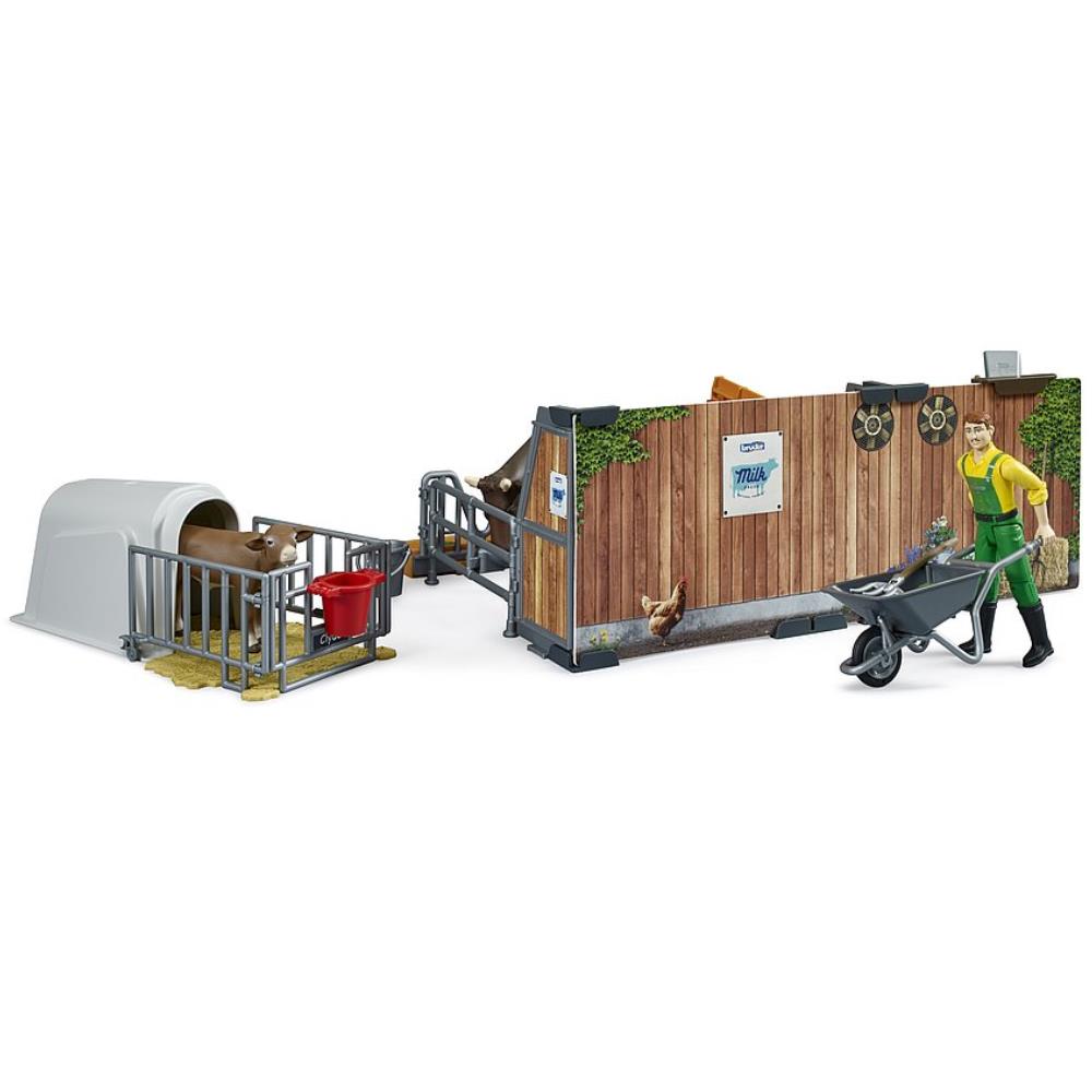 Frère vache et veau stable avec agriculteur