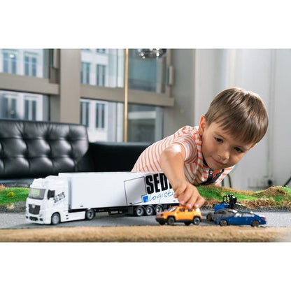 Camion Mercedes Bburago avec chariot élévateur et accessoires