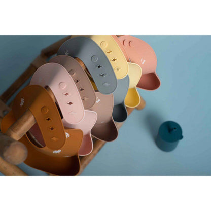 Bavoir en silicone SOINA, jaune pastel