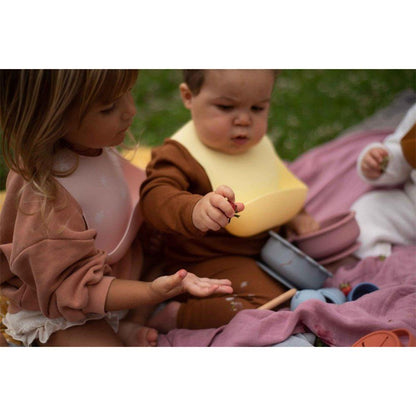 Bavoir en silicone SOINA, jaune pastel